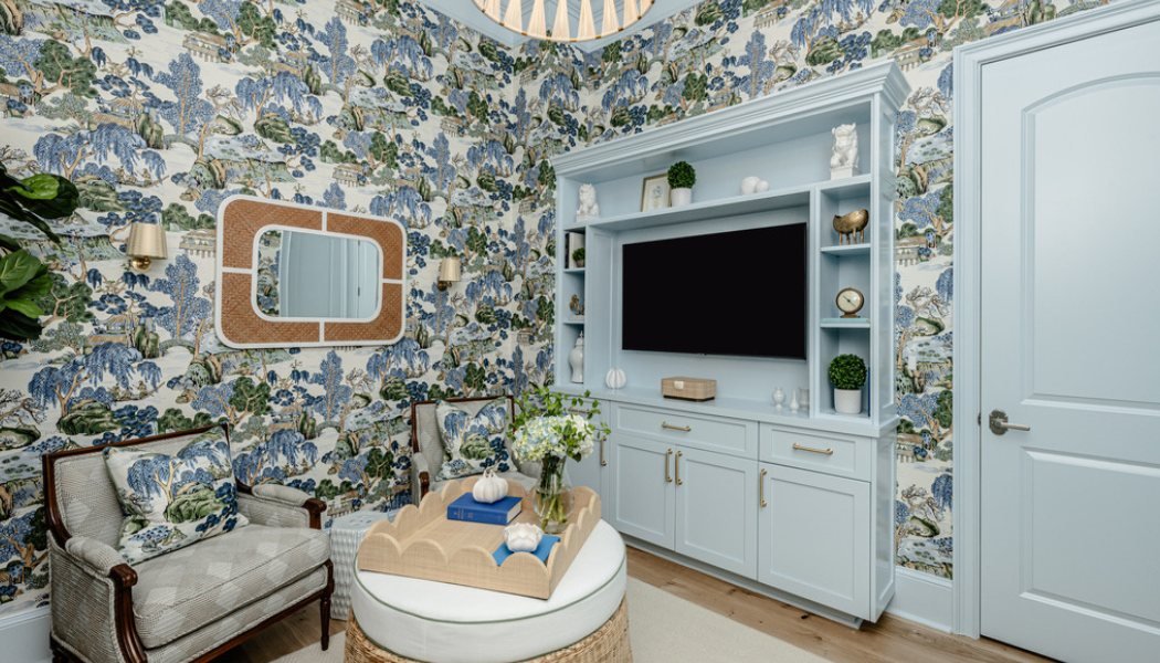 Sitting room in blue chinoiserie wallpaper with pale blue built-ins