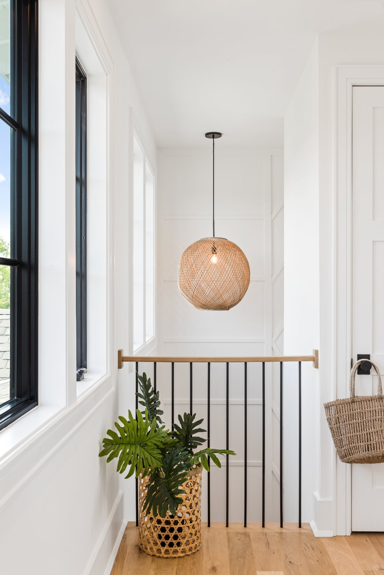 Arched breezeway with lanterns, palms, and cobalt planters