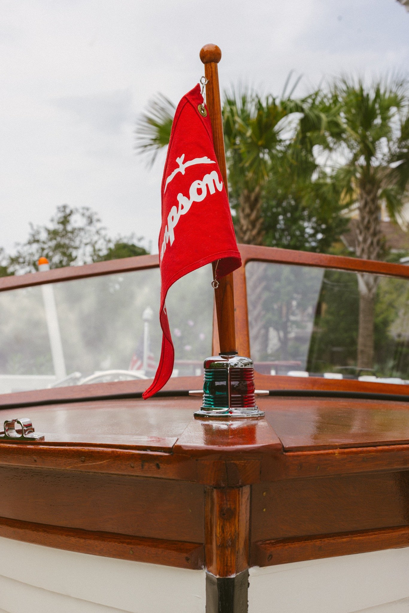 Bow light and red Thompson pennant with palmettos behind