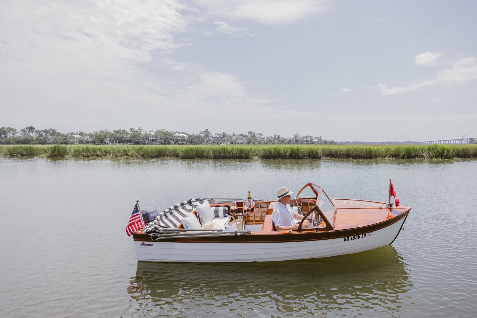 Old Saulty at rest on open water with the marsh behind
